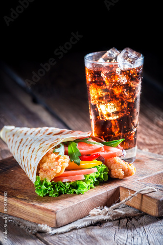 Tasty tortilla with cold drink