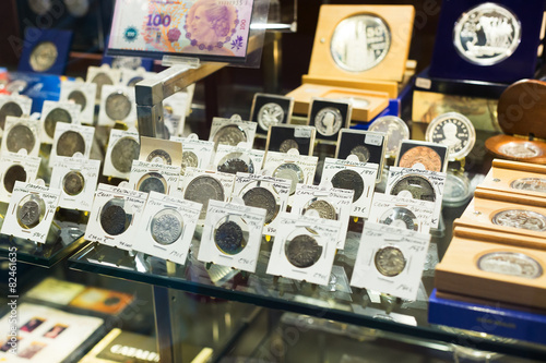 Coins on counter at numismatics store