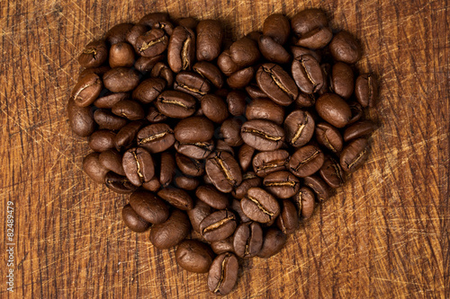 heart from coffee on a wooden background