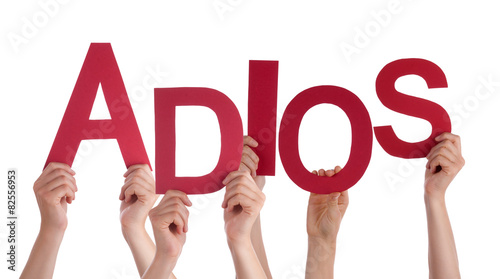 People Holding Spanish Word Adios Means Goodbye