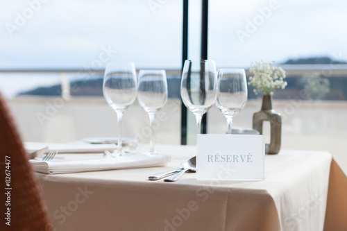 restaurant table by the window looking at sea