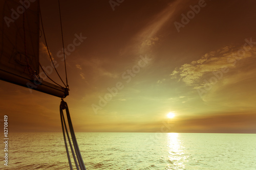 Yachting yacht sailboat in baltic sea at sunset sunrise.