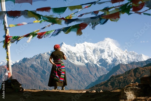 Nepalese woman and Langtang peak