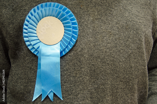 Blue Rosette on Conservative Party Supporter