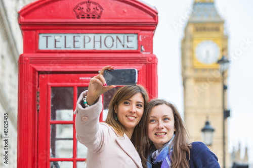 Two women taking a selfie in London.