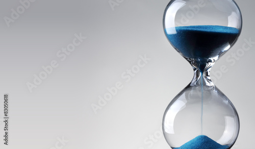 Time passing. Blue hourglass.