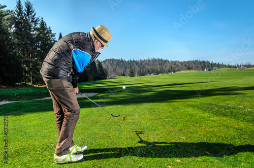 Senior citizen is playing golf
