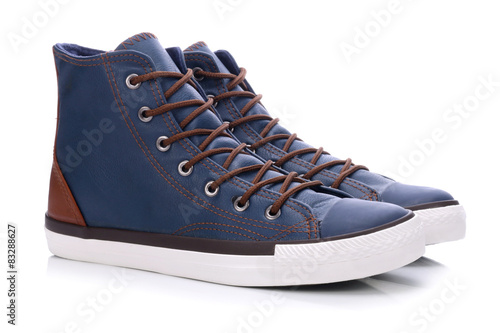 Pair of blue sneakers on a white background 