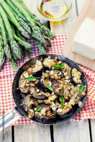 Eggplants aubergines sautéed with breadcrumbs and cheese