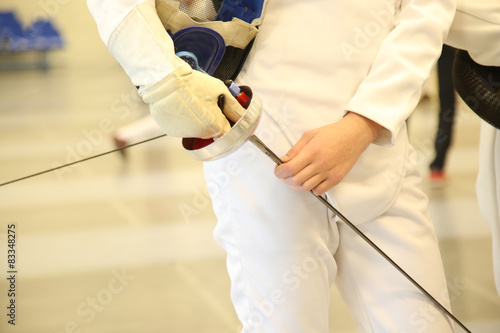 fencer with fencing mask and rapier