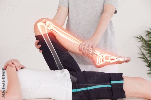 Highlighted bones of woman at physiotherapist 