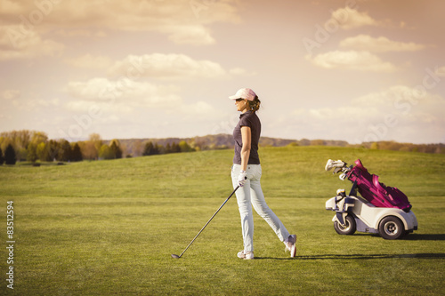 Woman golf player with copyspace.