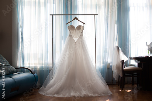 The perfect wedding dress with a full skirt on a hanger 