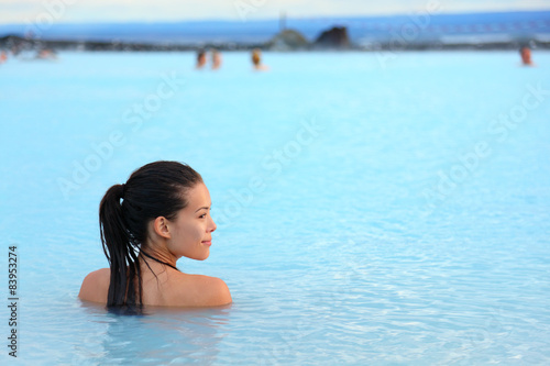 Geothermal spa - woman relaxing in hot spring pool