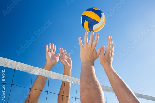 Friends playing volleyball