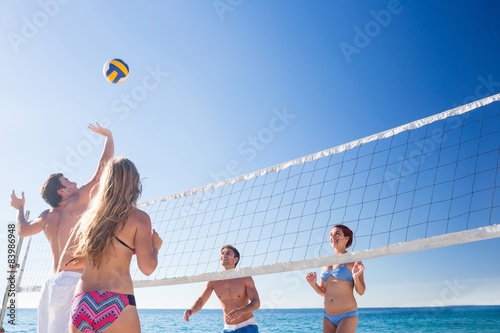 Group of friends playing volleyball