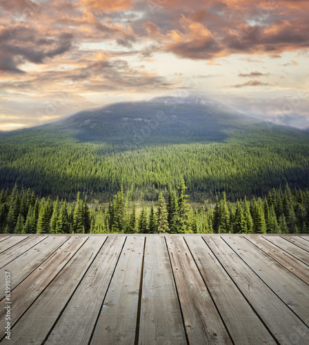 Wooden deck overlooking scenic view of mountains