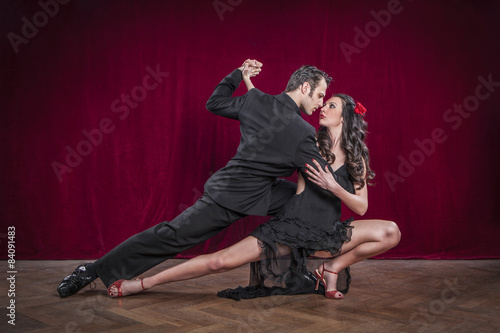 Portrait of young elegant tango dancers.