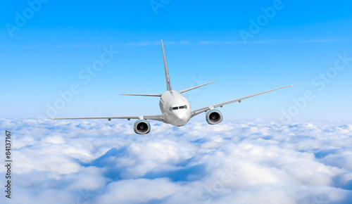 airplane in the sky. Passenger jet air plane flying on blue sky