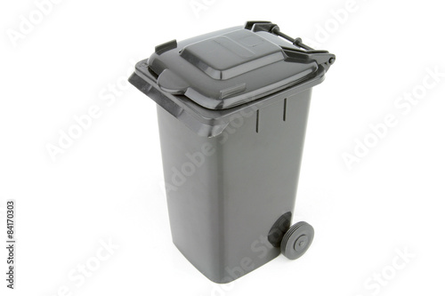 Grey garbage wheelie bin with a closed lid on a white background.