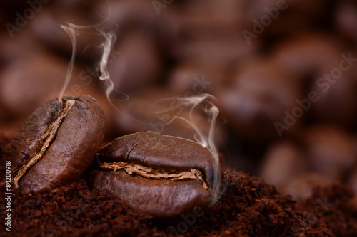 Closeup of coffee beans at roasted coffee heap. 