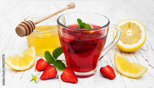 Fruit tea with strawberries and honey