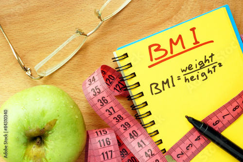 BMI body mass index formula in a notepad.