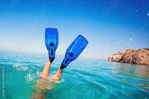 Flippers in water. Diver fins. Active vacation at sea. Diving.