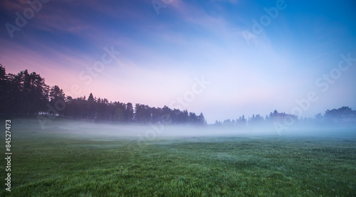 Morning fog in the valley with bright blue sky