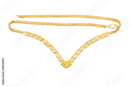 Gold necklace over white background