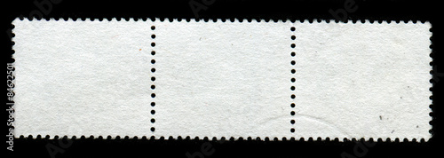 Reverse side of a postage stamp.