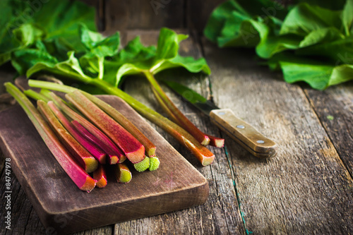 fresh organic rhubarb on cutting board