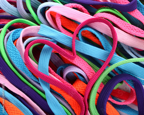 Colorful shoe laces and heart shaped pink shoelace
