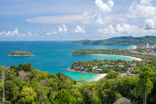 Beautiful turquoise ocean waves with boats and coastline from high view point. Kata and Karon beaches Phuket Thailand