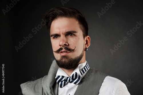 handsome guy with beard and mustache in suit