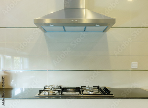 cooking gas stove with hood in modern kitchen