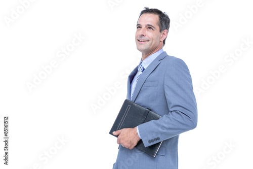  Focused businessman holding a notebook