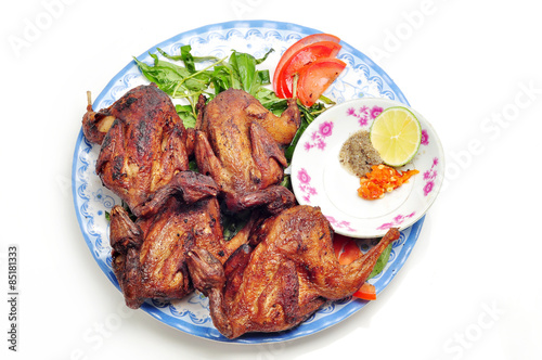 Vietnamese grilled quail on a white background