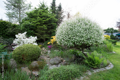 Beautiful spring garden design with rhododendron