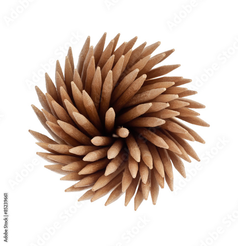 Toothpicks forming a spiral shape isolated on white background 