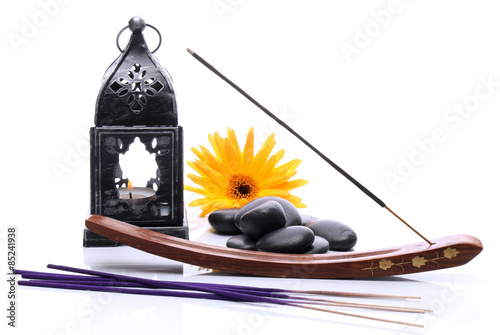 Lantern and incense on a white background