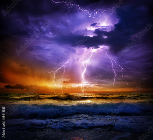lightning and storm on sea to the sunset - bad weather 