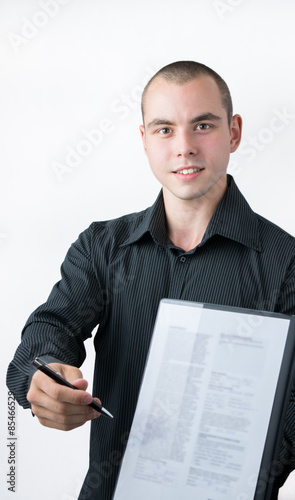 Man handing a contract to sign
