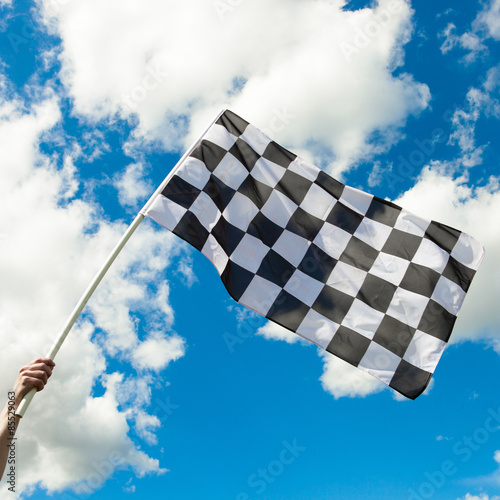 Checkered flag waving in the wind - close up outdoors shot