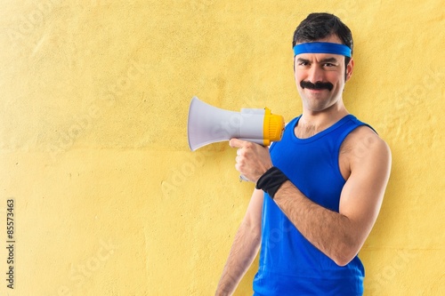 Sportman shouting by megaphone