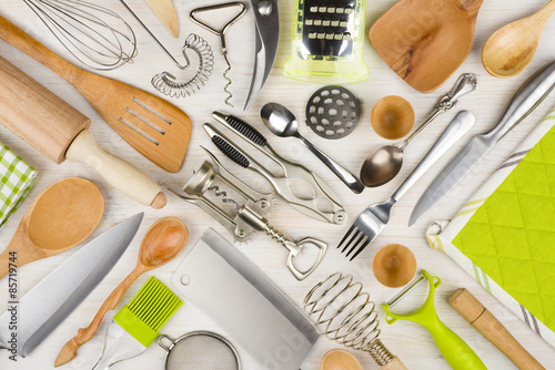 Background of kitchen utensils on wooden kitchen table