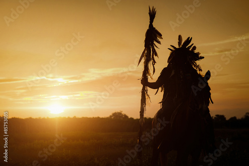 The Indians are riding a horse