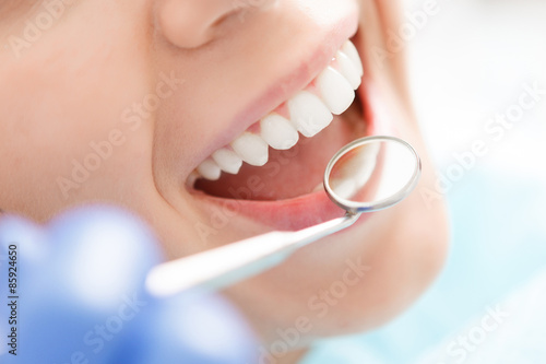 Close-up of woman having her teeth examined 