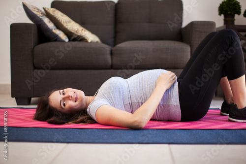 Pregnant mom exercising at home