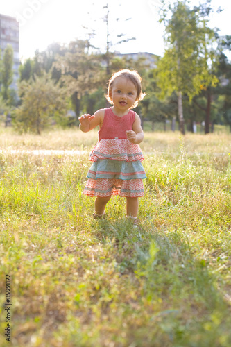 one-year-old girl on walk in park